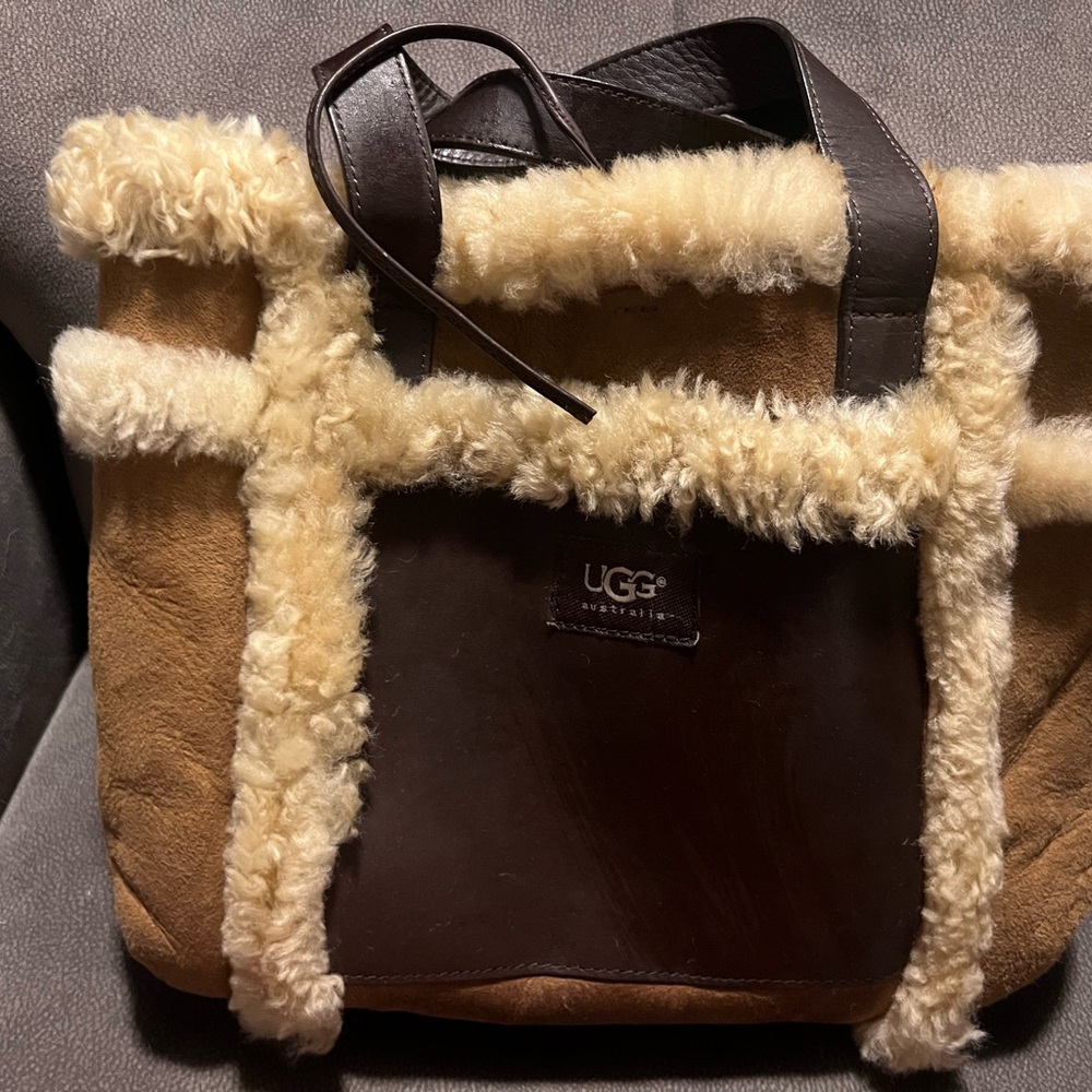 UGG Cream and Brown Shearling Tote with storage bag.  Like new never used